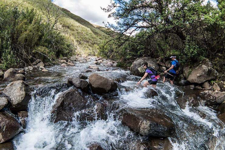 Traversing a waterfall during Lesotho Ultra